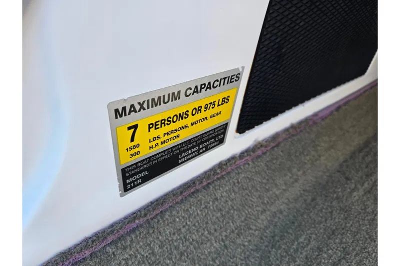 Slide: The Image of 2016 Legend Alpha 211R DC boat capacity label, maximum 7 persons or 975 lbs. - 14