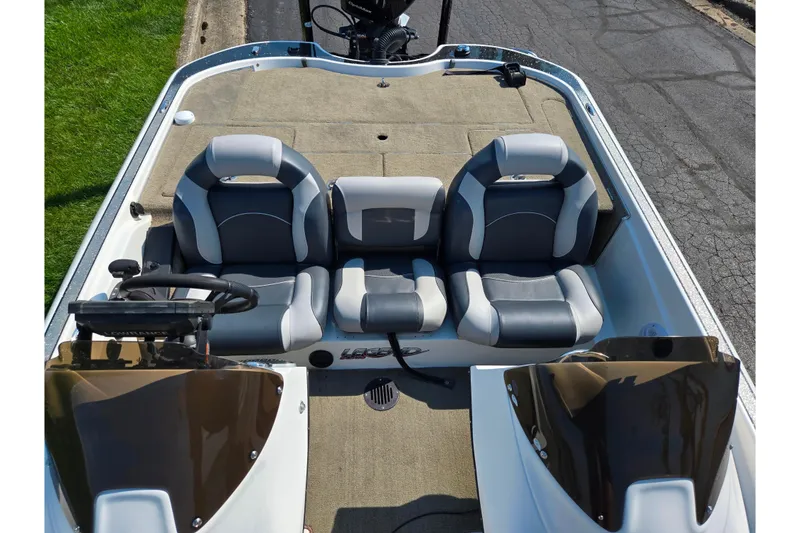 Slide: The Image of 2016 Legend Alpha 211R DC boat interior with dual seats and steering console. - 20