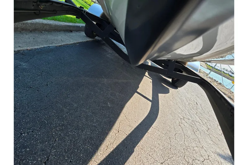 Slide: The Image of Underneath view of a 2016 Legend Alpha 211R DC boat on a trailer. - 7
