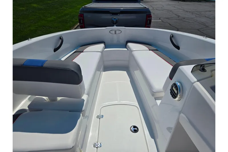 Slide: The Image of 2024 Tahoe T16 boat interior with cushioned seating and sleek design. - 13