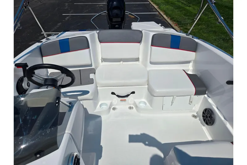 Slide: The Image of 2024 Tahoe T16 boat interior with seating, steering wheel, and modern design. - 20