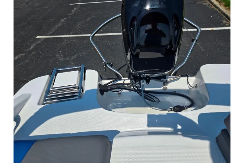 Slide: The Image of 2024 Tahoe T16 boat engine and ladder on a sunny day. - 22