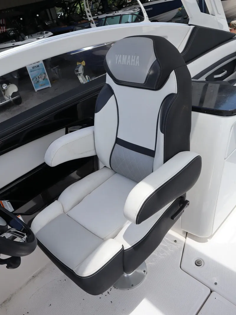 Slide: The Image of Yamaha Boats 275SD 2020 captain's chair in white and black. - 12