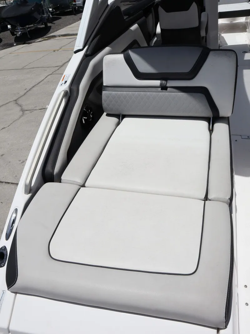 Slide: The Image of 2020 Yamaha Boats 275SD lounge area with white leather upholstery. - 21