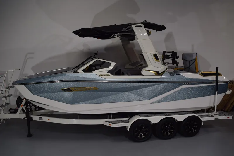 The Image of 2026 Nautique Super Air Nautique G25 Paragon boat on trailer, side view. - 0