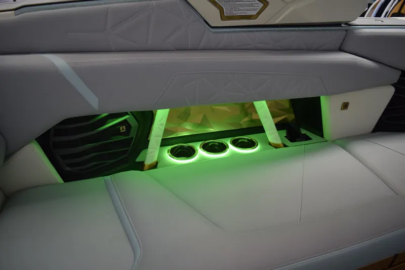 Slide: The Image of 2026 Nautique Super Air Nautique G25 Paragon interior with illuminated cup holders and sleek design. - 11