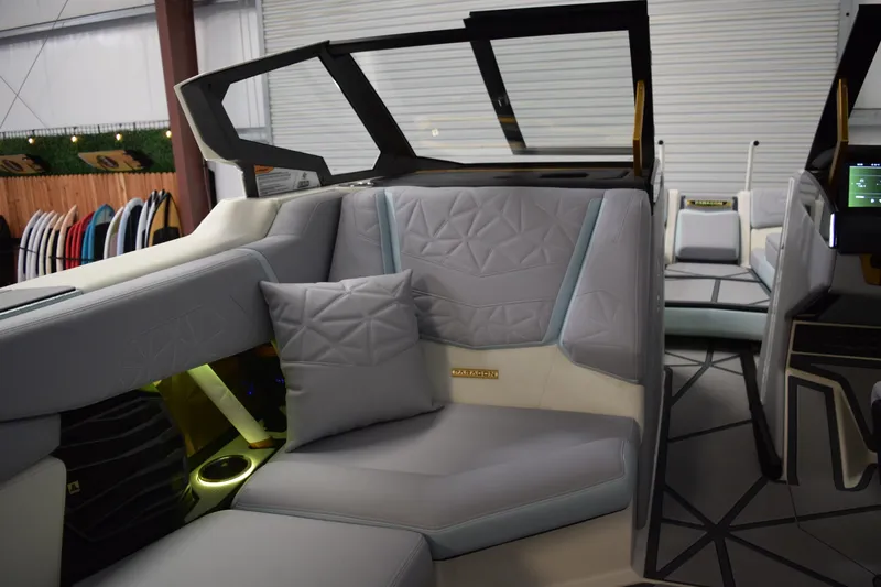 Slide: The Image of Luxurious interior of 2026 Nautique Super Air Nautique G25 Paragon boat with plush seating. - 12