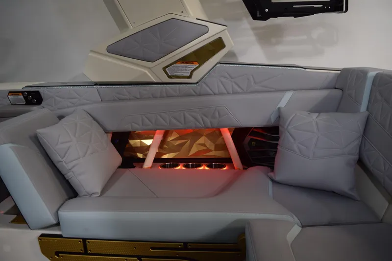 Slide: The Image of Luxurious interior of 2026 Nautique Super Air Nautique G25 Paragon with plush seating. - 14