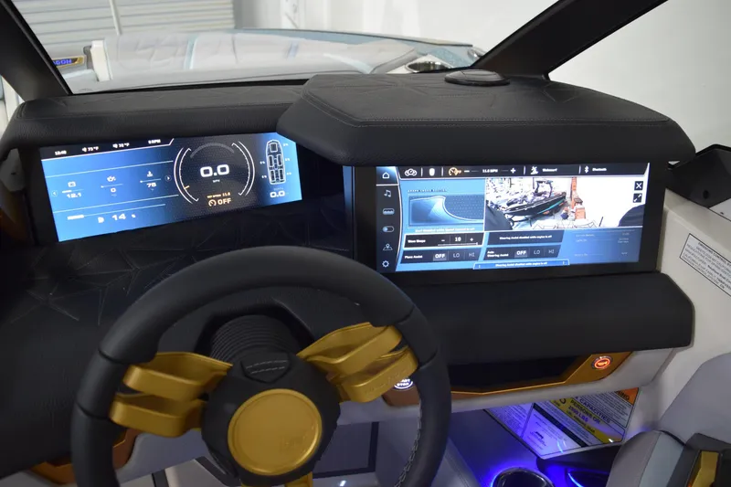 Slide: The Image of 2026 Nautique Super Air Nautique G25 Paragon dashboard with advanced digital displays and controls. - 18
