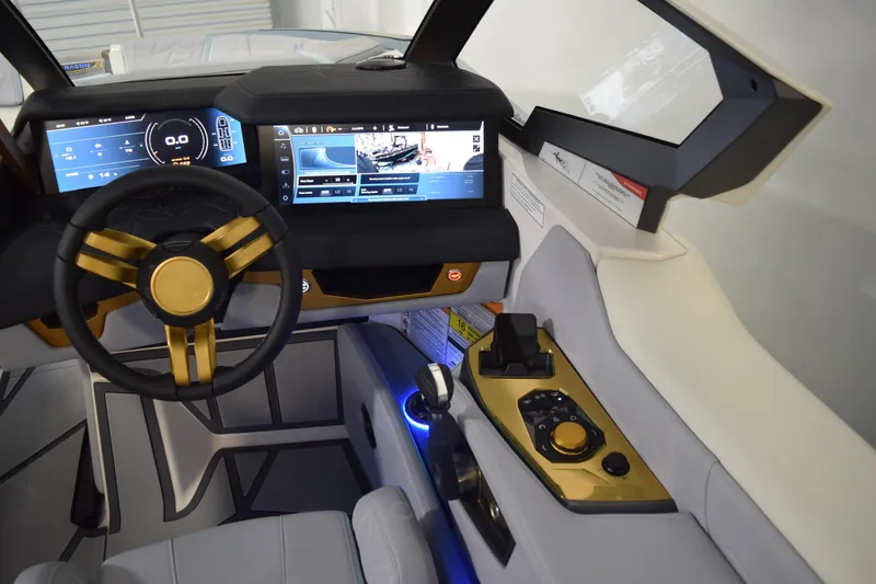Slide: The Image of Interior of 2026 Nautique Super Air Nautique G25 Paragon with advanced dashboard controls. - 19