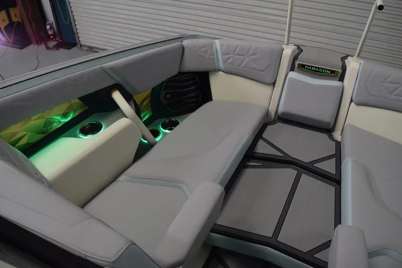 Slide: The Image of Interior of 2026 Nautique Super Air Nautique G25 Paragon with ambient lighting and luxury seating. - 21