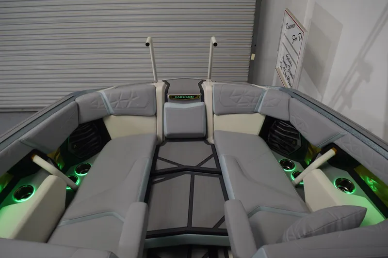 Slide: The Image of Interior of 2026 Nautique Super Air Nautique G25 Paragon with ambient lighting and luxury seating. - 22