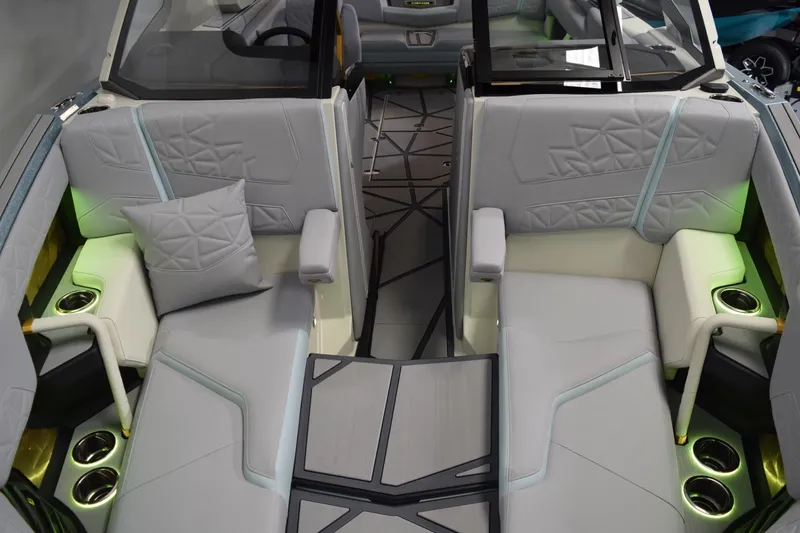 Slide: The Image of Luxurious interior of 2026 Nautique Super Air Nautique G25 Paragon with modern seating and ambient lighting. - 23