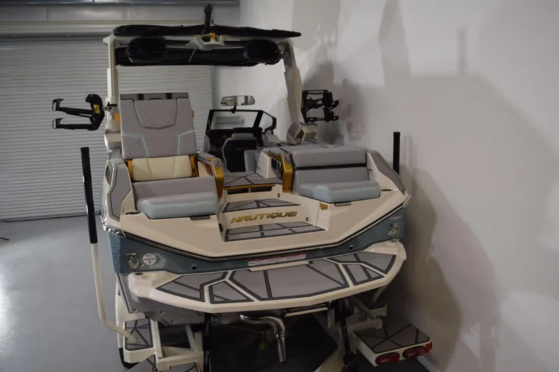 Slide: The Image of 2026 Nautique Super Air Nautique G25 Paragon boat in a garage setting. - 4