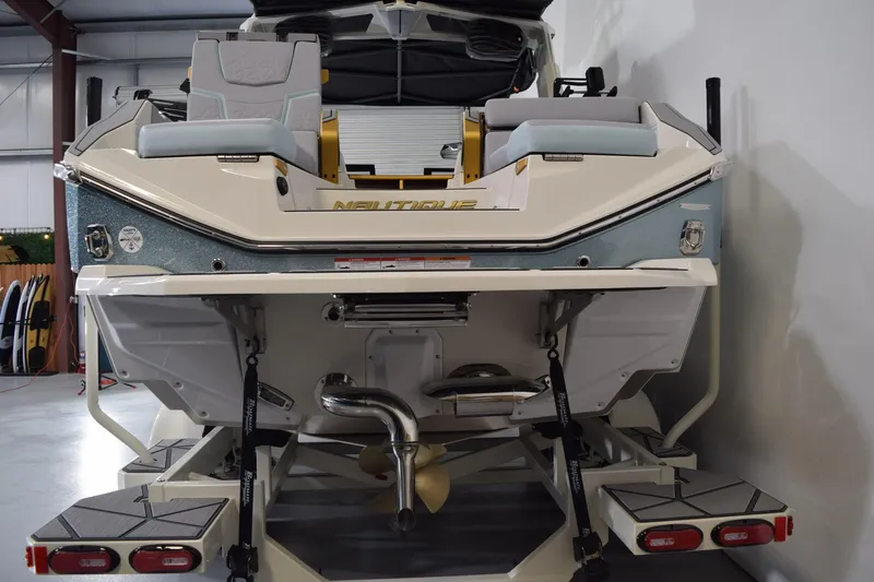 Slide: The Image of 2026 Nautique Super Air Nautique G25 Paragon boat rear view in showroom. - 5