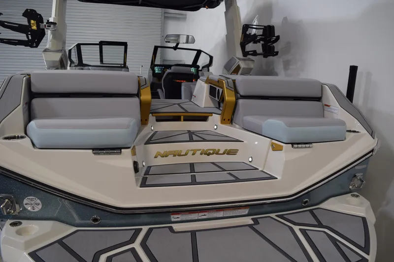 Slide: The Image of 2026 Nautique Super Air Nautique G25 Paragon boat interior with luxurious seating and modern design. - 9