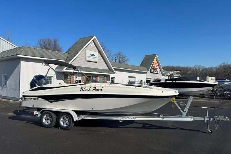 Slide: The Image of 2009 SouthWind 210 SD boat named "Black Pearl" on trailer at dealership. - 10