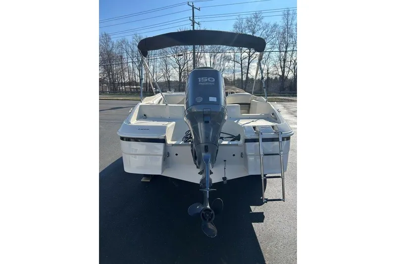 Slide: The Image of 2009 SouthWind 210 SD boat with Yamaha 150 outboard motor and swim ladder. - 11