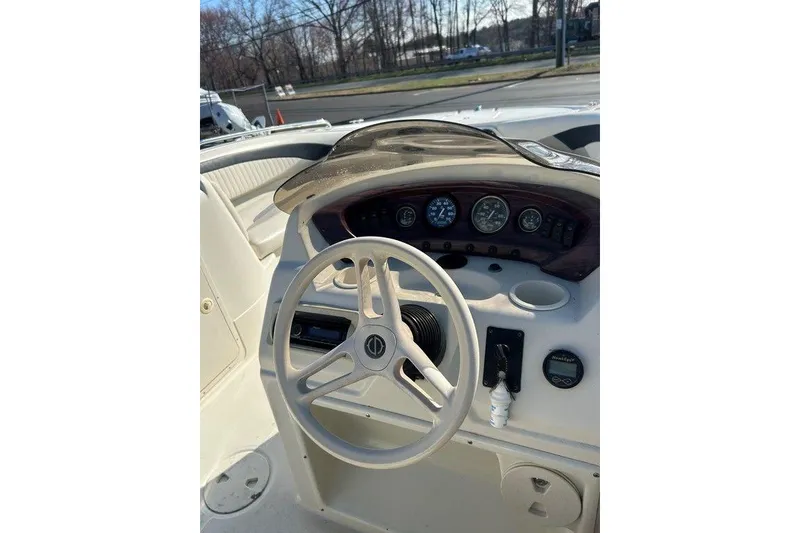 Slide: The Image of Steering console of a 2009 SouthWind 210 SD boat with gauges and controls. - 15