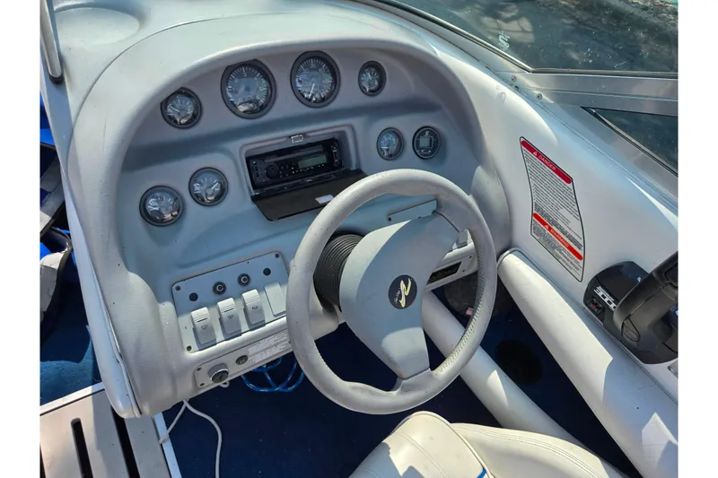 Slide: The Image of 1994 Sea Ray 180 Bow Rider dashboard with steering wheel and instrument panel. - 14
