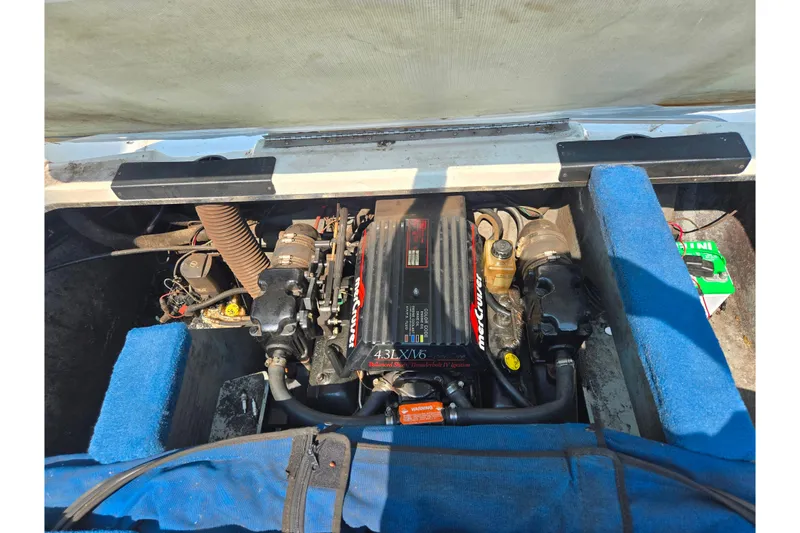 Slide: The Image of Engine compartment of a 1994 Sea Ray 180 Bow Rider boat, featuring a MerCruiser 4.3L V6 engine. - 24