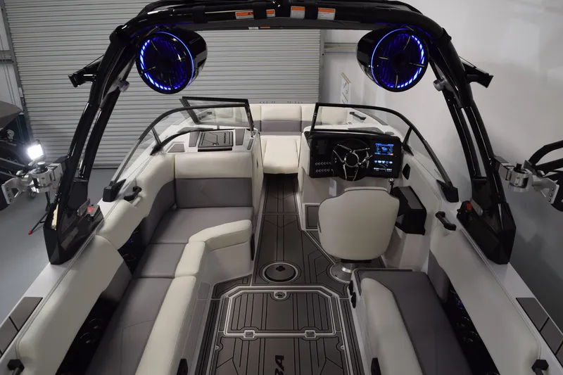 Slide: The Image of 2026 Moomba Tykon boat interior with modern seating and advanced dashboard features. - 13
