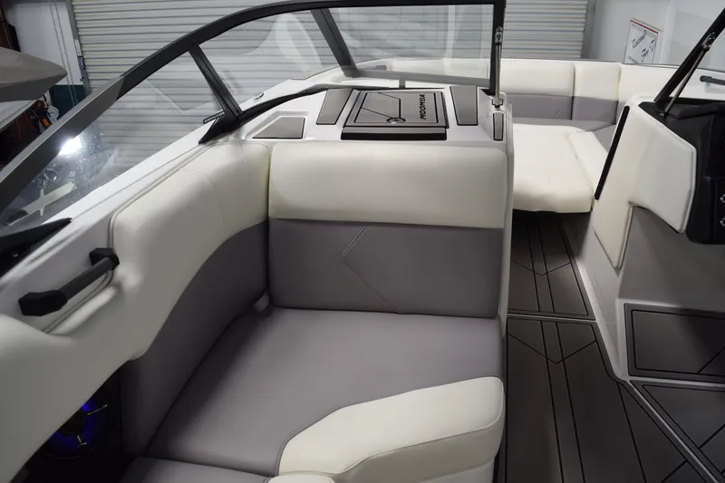 Slide: The Image of 2026 Moomba Tykon boat interior with modern seating and sleek design. - 16