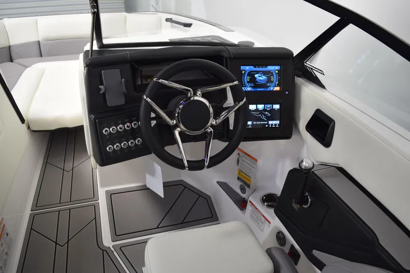Slide: The Image of 2026 Moomba Tykon boat interior with modern steering and digital dashboard display. - 17