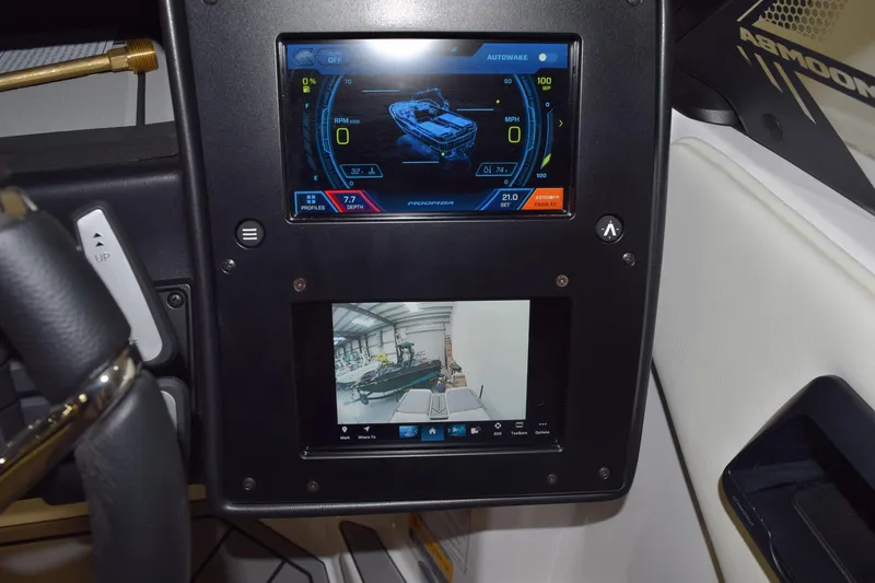 Slide: The Image of Dashboard of 2026 Moomba Tykon boat with digital displays and controls. - 18