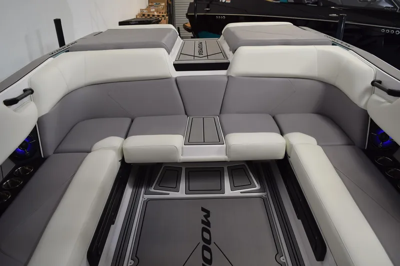 Slide: The Image of 2026 Moomba Tykon boat interior with gray and white seating, modern design. - 20