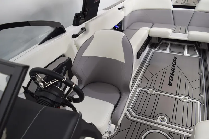 Slide: The Image of Interior of 2026 Moomba Tykon boat with sleek seating and modern steering wheel. - 24