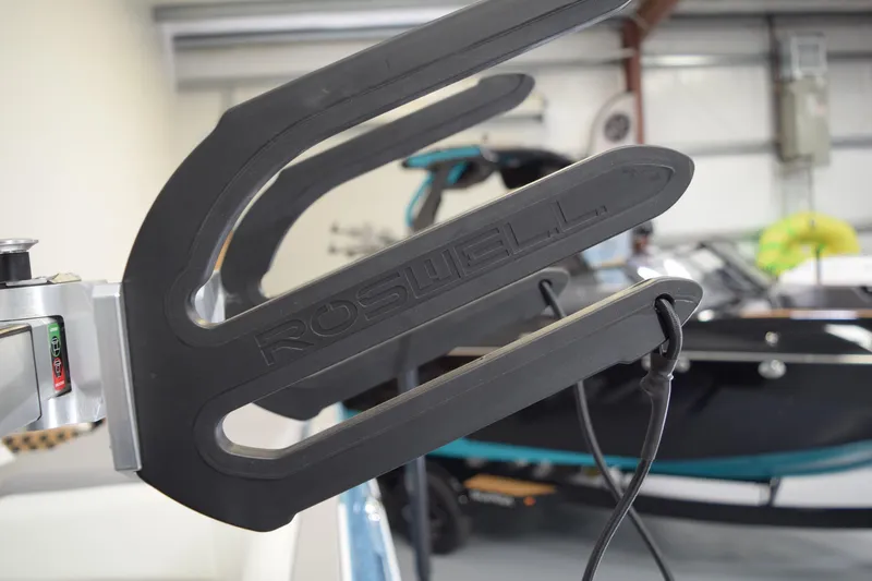 Slide: The Image of Roswell wakeboard rack on 2026 Moomba Tykon boat in showroom setting. - 27