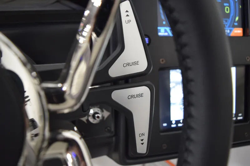 Slide: The Image of Close-up of 2026 Moomba Tykon steering wheel with cruise control buttons. - 30