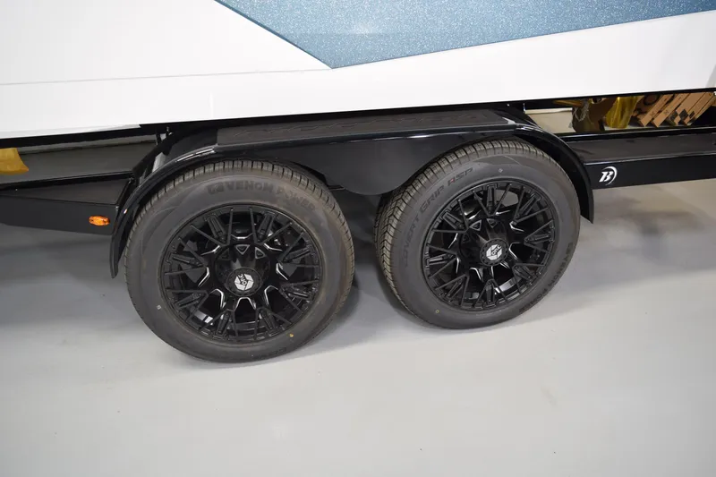 Slide: The Image of 2026 Moomba Tykon trailer with black alloy wheels and Venom tires. - 5
