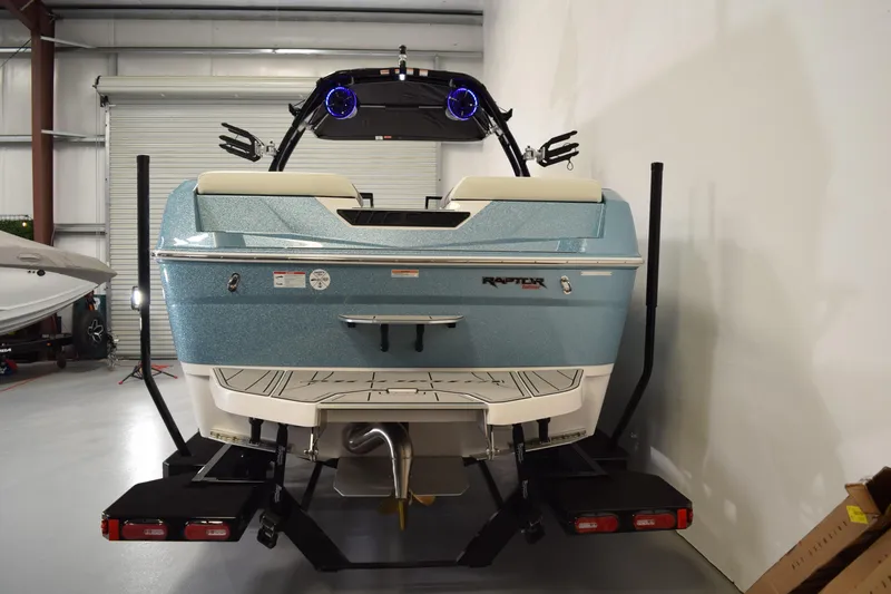 Slide: The Image of 2026 Moomba Tykon boat in a garage, showcasing rear design and features. - 6