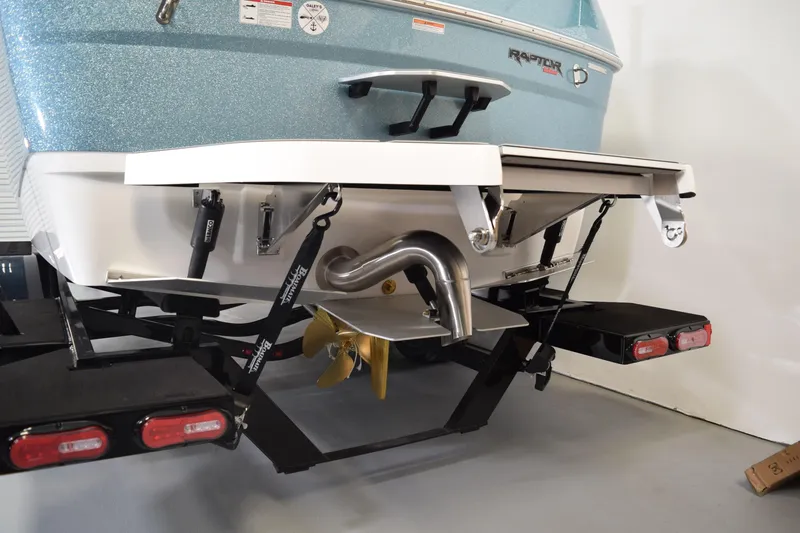 Slide: The Image of Rear view of 2026 Moomba Tykon boat showcasing propeller and exhaust system. - 7