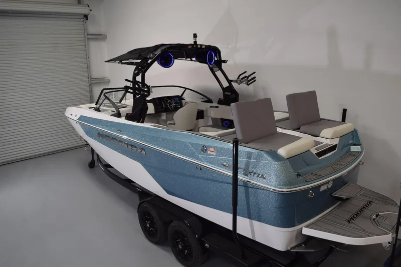 Slide: The Image of 2026 Moomba Tykon boat in showroom, featuring sleek design and modern amenities. - 9