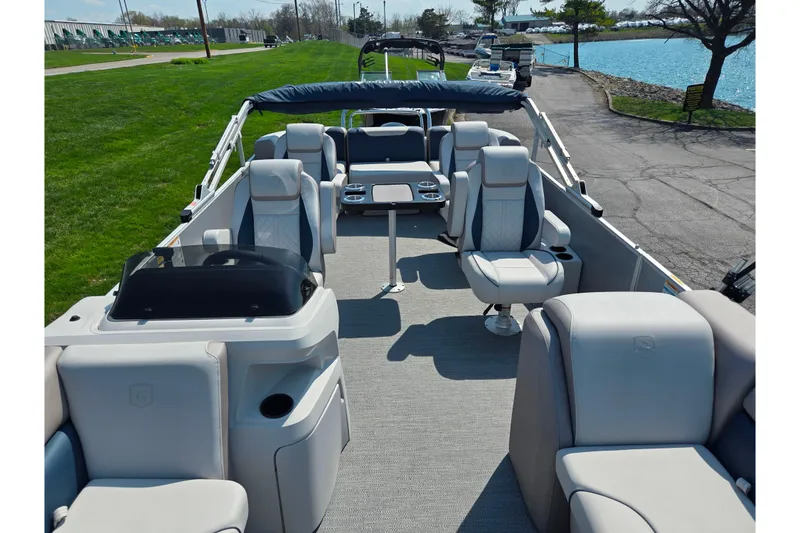 Slide: The Image of 2025 Godfrey Sweetwater 2286 QS pontoon boat interior with plush seating and modern design. - 13