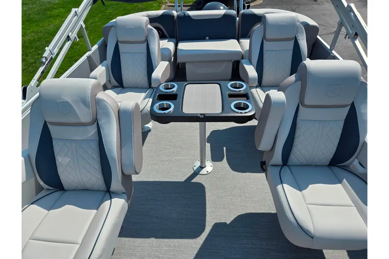 Slide: The Image of Luxurious seating on 2025 Godfrey Sweetwater 2286 QS pontoon boat with table and cup holders. - 15