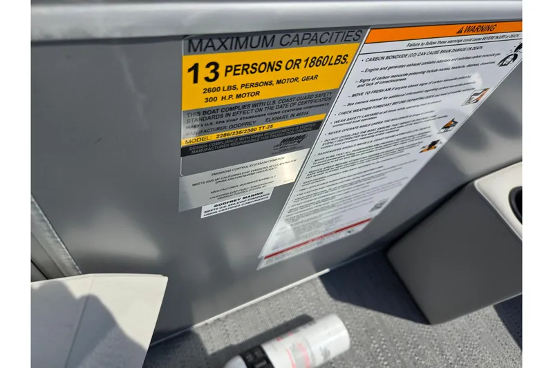 Slide: The Image of Capacity label on 2025 Godfrey Sweetwater 2286 QS boat, showing maximum 13 persons or 1860 lbs. - 16