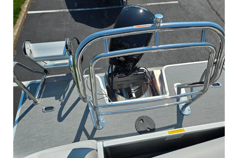 Slide: The Image of 2025 Godfrey Sweetwater 2286 QS boat with stainless steel railing and motor. - 19