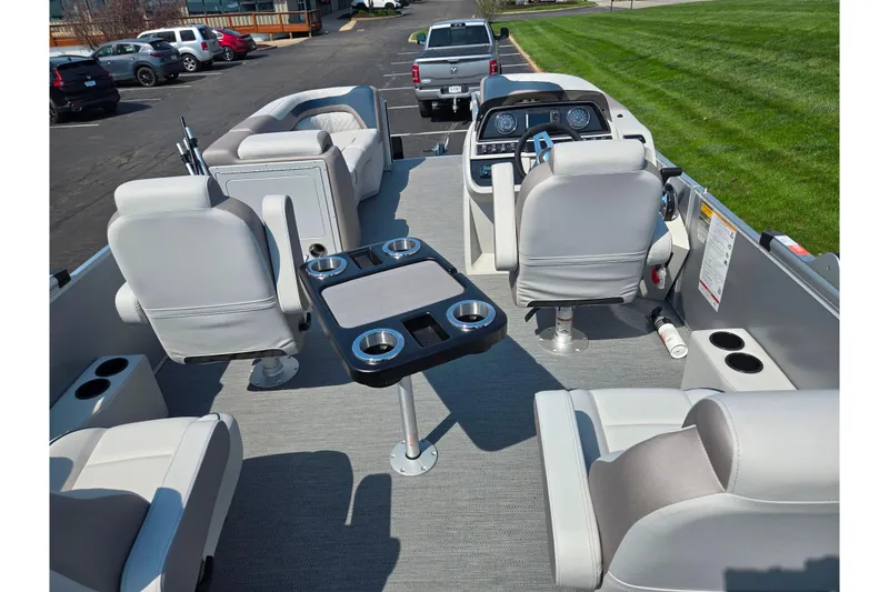 Slide: The Image of 2025 Godfrey Sweetwater 2286 QS pontoon boat interior with seating and control panel. - 20