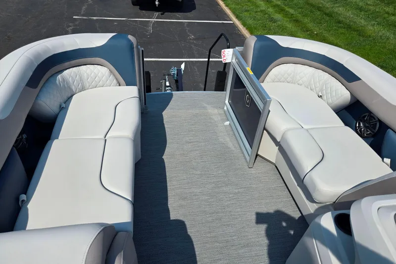Slide: The Image of Interior view of 2025 Godfrey Sweetwater 2286 QS pontoon boat with plush seating. - 25