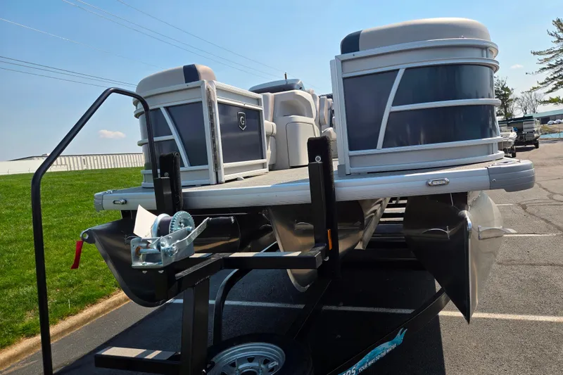 Slide: The Image of 2025 Godfrey Sweetwater 2286 QS pontoon boat on trailer in parking lot. - 6