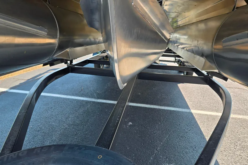 Slide: The Image of Underneath view of a 2025 Godfrey Sweetwater 2286 QS pontoon boat on a trailer. - 7