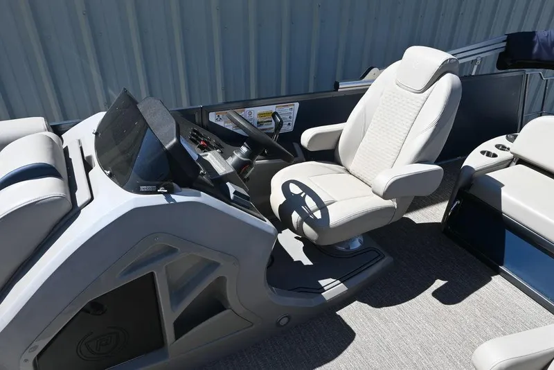 Slide: The Image of 2020 Premier 230 Sunsation RL - CL boat interior with captain's chair and steering console. - 10