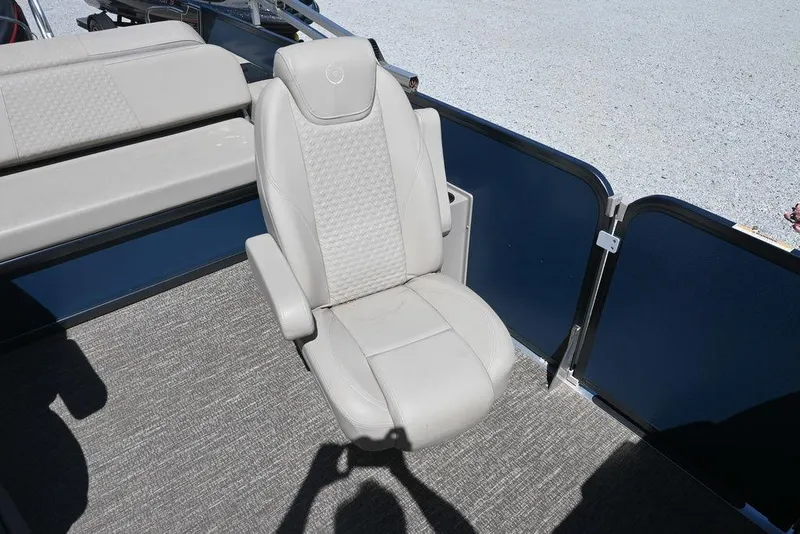 Slide: The Image of Captain's chair on 2020 Premier 230 Sunsation RL - CL pontoon boat, featuring beige upholstery. - 12