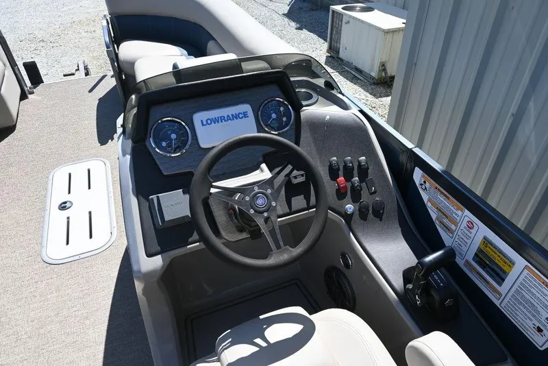 Slide: The Image of Cockpit of 2020 Premier 230 Sunsation RL - CL pontoon boat with steering wheel and controls. - 5