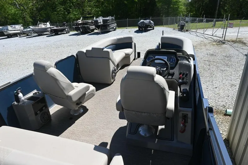 Slide: The Image of 2020 Premier 230 Sunsation RL-CL pontoon boat interior with seating and steering console. - 7