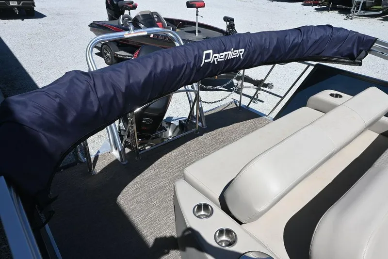 Slide: The Image of 2020 Premier 230 Sunsation RL - CL pontoon boat interior with cushioned seating and protective cover. - 8
